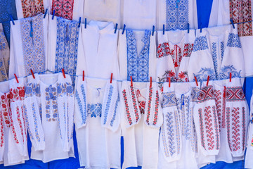 Bright ethnic shirts with traditional Ukrainian embroidery for sale on a street festival
