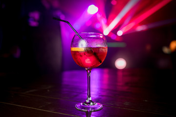 Sweet Famous aperol spritz champagne orange slice Author inspired Cocktail Drink on bar counter. Close-up Top view near girl . Copy paste space for design people and luxury service barman in nightclub