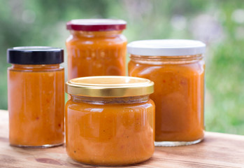 Composition of apricot jam cans cooked from summer  berry harvest