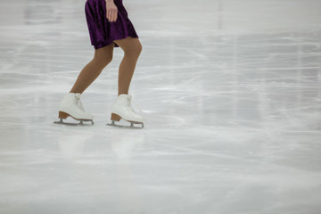 Obraz premium Figure skating, ice skating training. Feet skater on the ice
