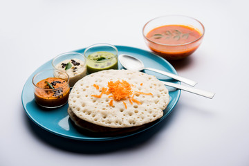 Set Dosa / Oothappam style dosa is a popular south Indian food served with sambar and chutney, selective focus