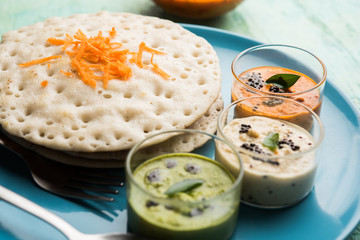 Set Dosa / Oothappam style dosa is a popular south Indian food served with sambar and chutney, selective focus