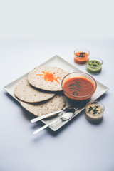 Set Dosa / Oothappam style dosa is a popular south Indian food served with sambar and chutney, selective focus