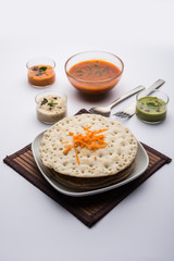 Set Dosa / Oothappam style dosa is a popular south Indian food served with sambar and chutney, selective focus