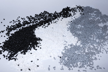 Granules of termoplastic elastomer on a white background