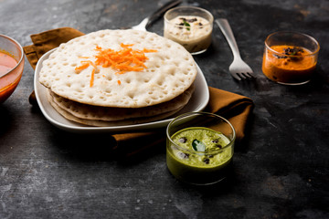 Set Dosa / Oothappam style dosa is a popular south Indian food served with sambar and chutney, selective focus
