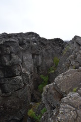 Fototapeta na wymiar Landscape with many lava craters at grotto Grotagja Cave in Myvatn, Iceland 