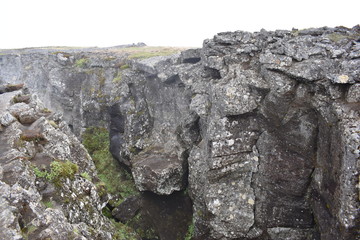 Landscape with many lava craters at grotto Grotagja Cave in Myvatn, Iceland 