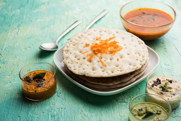 Set Dosa / Oothappam style dosa is a popular south Indian food served with sambar and chutney, selective focus