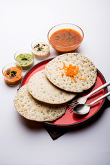 Set Dosa / Oothappam style dosa is a popular south Indian food served with sambar and chutney, selective focus