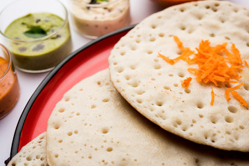 Set Dosa / Oothappam style dosa is a popular south Indian food served with sambar and chutney, selective focus