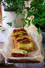 Italian cake with salami, potatoes and provolone.selective focus