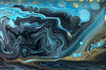 Blue and gold marbling pattern. Golden powder marble liquid texture.