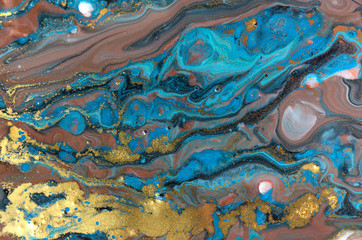 Blue and gold marbling pattern. Golden powder marble liquid texture.
