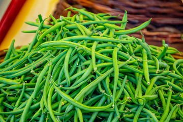 Fresh green bean in a farmer agricultural open air market, seasonal healthy food. Concept of biological, bio products, bio ecology, grown by yourself, vegetarians