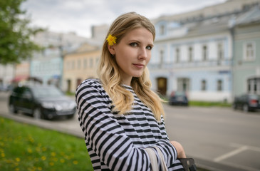Fototapeta premium Outdoors portrait of beautiful young woman. Selective focus.