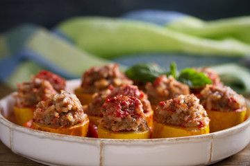 Zucchini stuffed with meat, rice and vegetables in tomato sauce. Loaded zucchini