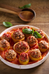 Zucchini stuffed with meat, rice and vegetables in tomato sauce. Loaded zucchini