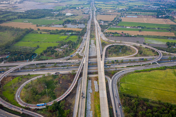 interchange freeway and highway connecting the city transportation logistics countrysideside and agricultural area in Thailand