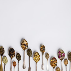 Assortment of dry tea in vintage spoons