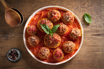 Zucchini stuffed with meat, rice and vegetables in tomato sauce. Loaded zucchini