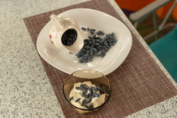 Summer arbor. The Utrenny light breakfast from berries. A honeysuckle with a wild strawberry and sour cream.