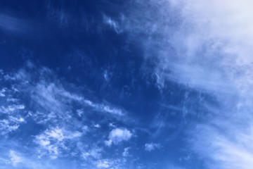 Beautiful cirrus cloud formations in a deep blue sky