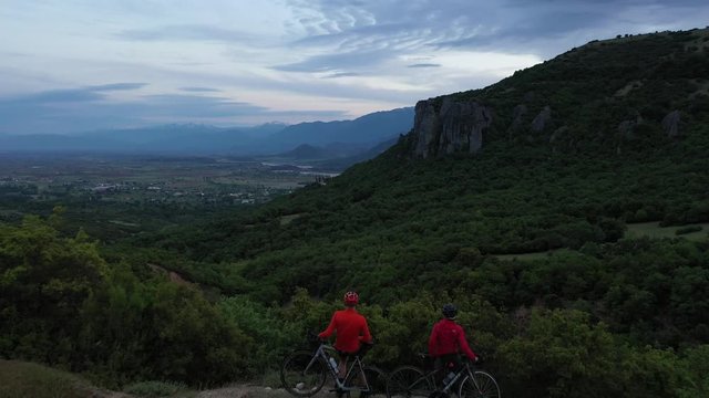 Cyclist going uphill on a beautiful paved mountain road in Greece