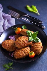 Delicious homemade burgers or patties and vegetables