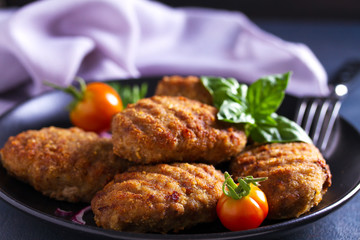 Delicious homemade burgers or patties and vegetables
