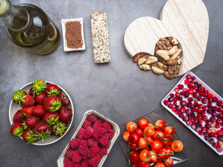 Healthy diet for the cardiovascular system with a wooden heart, seeds, berries, nuts cocoa oil, heart-healthy diet products