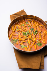 Dhaba style Sev bhaji/sabzi/curry made in tomato curry with gathiya shev, served in a bowl or karahi, selective focus