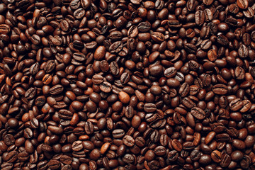 Roasted coffee beans brown seeds texture background wallpaper.