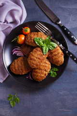 Delicious homemade burgers or patties and vegetables. View from above, top studio shot