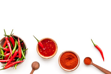Fresh and powdered red and green chilli pepper pattern on white table background top view space for text