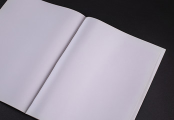 Magasine opened pages template mockup against a black background