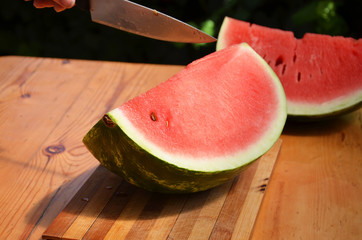 Colorful tropical fresh watermelon smoothie summer drinks in the glasses on wood table background....