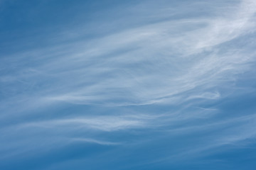 Blue sky with white clouds close up in the summertime