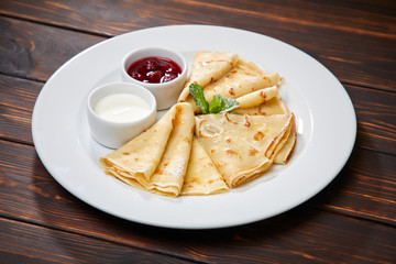 pancakes with sour cream and berry sauce