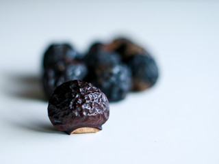 Sapindus rarak (lerak) on white background. In Indonesia lerak is used to wash batik.