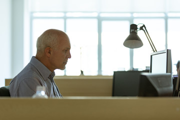 Businessman sitting working late in the evening
