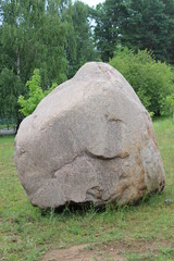  A huge stone in the middle of a green glade