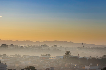 Sunrise with morning haze over the city