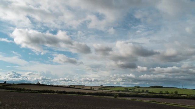 Cloudy Skies Timelapse Over Field