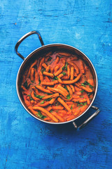 Dhaba style Sev bhaji/sabzi/curry made in tomato curry with gathiya shev, served in a bowl or karahi, selective focus