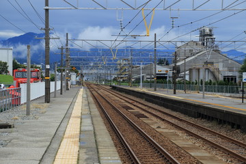 Fototapeta na wymiar TOYAMA, Kurobe, Japan - Kurobe Station at platfrom. Toyama. Japan. Asia.