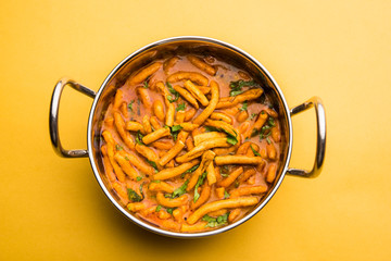 Dhaba style Sev bhaji/sabzi/curry made in tomato curry with gathiya shev, served in a bowl or karahi, selective focus