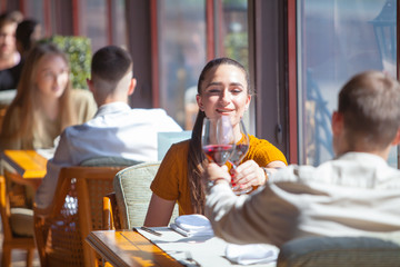 company of friends celebrates meeting in a restaurant.