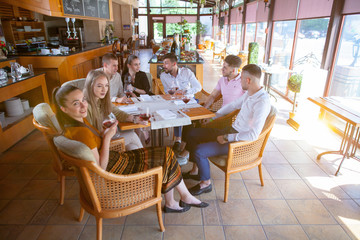 Fototapeta na wymiar company of friends celebrates meeting in a restaurant.