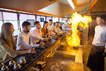 chef cooking seafood in a restaurant.
